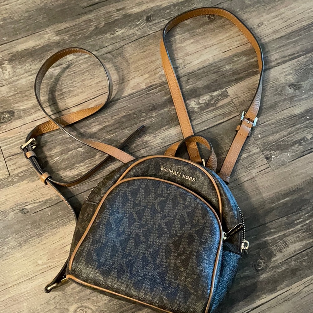 Michael Kors small backpack purse.